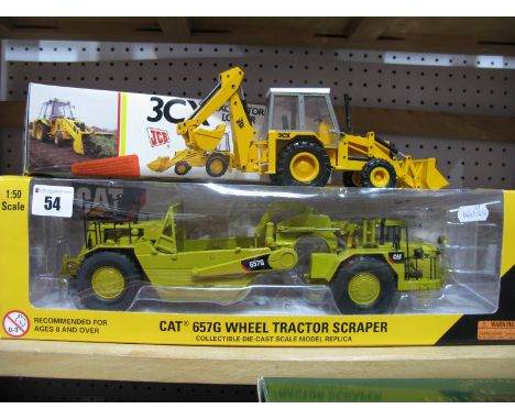 A Norscott 1:50th Scale Diecast Model #SS175 CAT 657G Wheel Tractor Scraper; together with a NZG Modelle 1:35th Scale Diecast