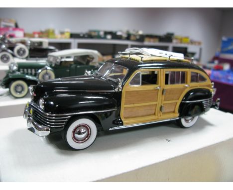 A Danbury Mint 1:24th Scale Diecast Model 1942 Chrysler Town and Country, accompanied by literature, no certification, boxed.