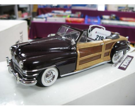 A Danbury Mint 1:24th Scale Diecast Model Chrysler 1948 Town and Country Convertible, 'Regal Maroon', certificate of title pr