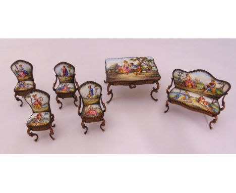 A miniature gilt metal and enamel table, sofa and matching chairs (6)