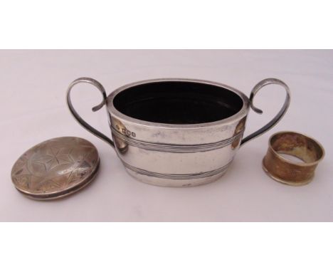 A Victorian hallmarked silver sugar bowl, London 1896 by William Hutton and sons, a napkin ring and compact, approx weighable