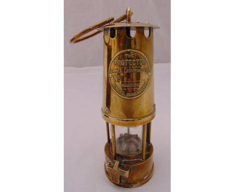 The Protector Lamp and Lighting Co. of Manchester brass mounted miners lamp, 24cm (h)