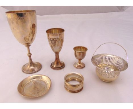 A quantity of hallmarked silver and white metal to include Kiddush cups, an egg cup, a coaster, a napkin ring and a bonbon di