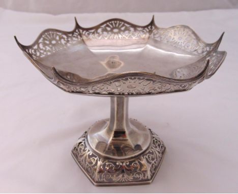 A hallmarked silver fruit stand with pierced hexagonal shaped border on raised scroll pierced hexagonal base, Sheffield 1936 