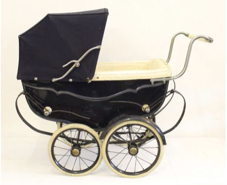 A vintage silver cross dolls pram, navy blue, folding hood, leather lined interior, on iron base with leather securing straps