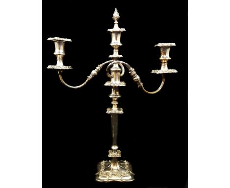 A Sheffield plated three light candelbra with scrolled arms, on single stick base, the central light with detachable bud fini