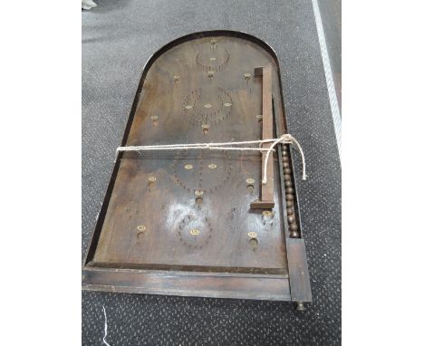 A vintage wooden Bagatelle board with ball bearings