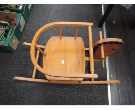 A vintage stained frame child's rocking horse, collectors item only