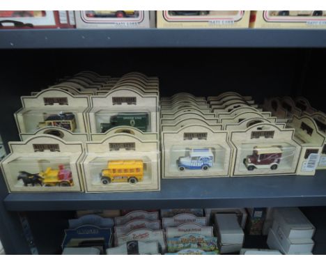 A shelf of Lledo Days Gone By die-cast vehicles, all in straw window boxes, approx 65