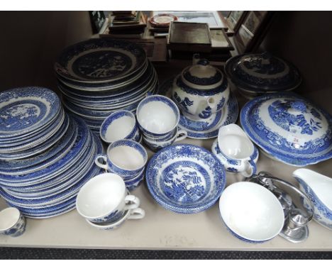 A shelf of 'old willow' tableware