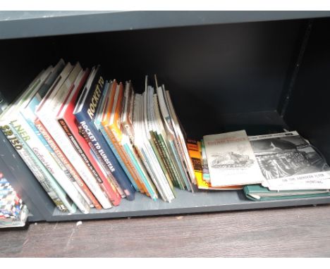 A shelf of railway related volumes, ephemera including records