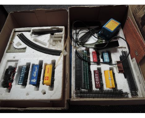 Two Hornby OO gauge part train sets including diesel locomotives with wagons and 0-4-0 tank engine with wagons