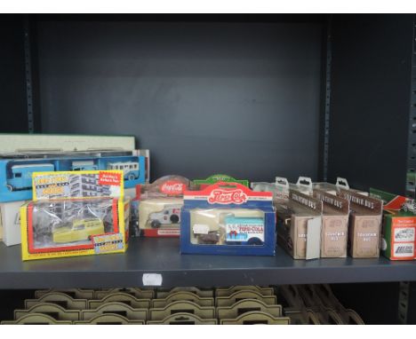 A shelf of modern Lledo die-cast advertising vehicles, Pepsi Cola, Only Fools and Horses etc, all boxed