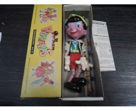 A vintage Pelham puppet, Pinnochio, in original box with instruction paper