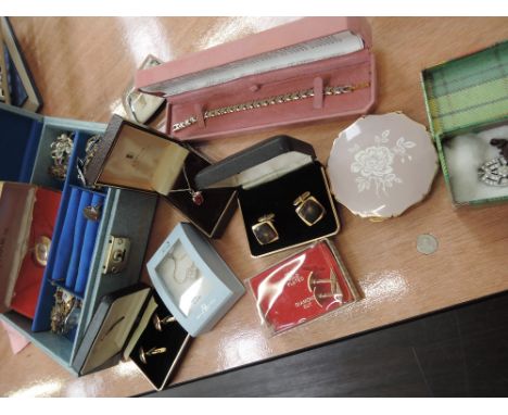 A selection of costume jewellery, Stratton compact