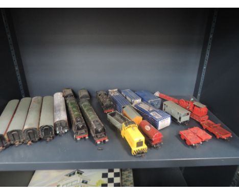 A shelf of Hornby Dublo OO gauge loco and tender and rolling stock including 4-6-2 Duchess of Montrose, two carriages, breakd