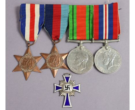 A Second World War group of four: France &amp; Germany Star, 1939-45 Star, Defence &amp; War Medals, un-named, mounted for we