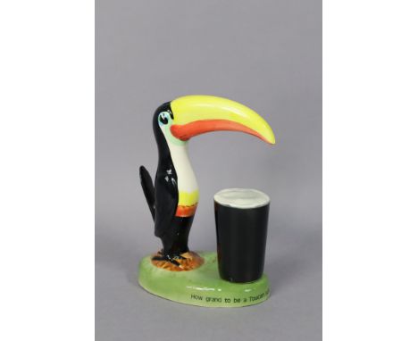 A Carlton ware “Guiness” toucan table lamp (requires rewiring), 21.5cm high.