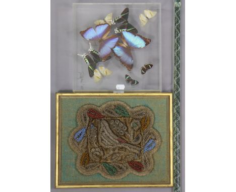 An early 20th century beadwork panel depicting a bird amongst flowers, 24cm &amp; 30.5cm, in a gilt frame; together with a Na