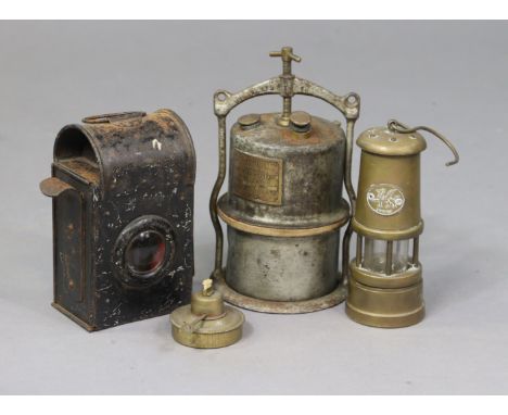 A railway lamp with burner; &amp; two miners’ lamps.