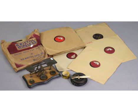 A vintage brass letter scale mounted on a wooden serpentine-front base, with weights; together with various records, etc.