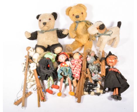 Collection of Pelham puppets, including skeleton, witch and others, along with three vintage plush teddy bears.