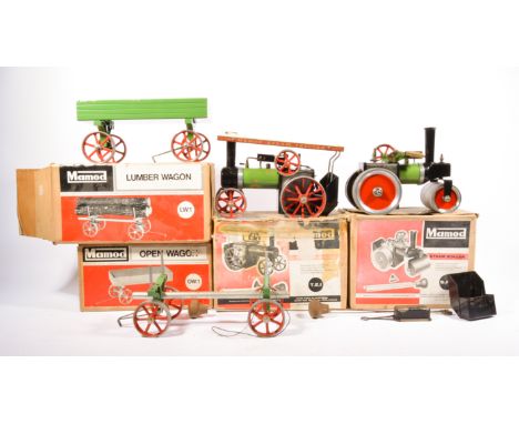 Mamod live steam traction engine, showmans engine, along with two Mamod trailers, all boxed, (4).