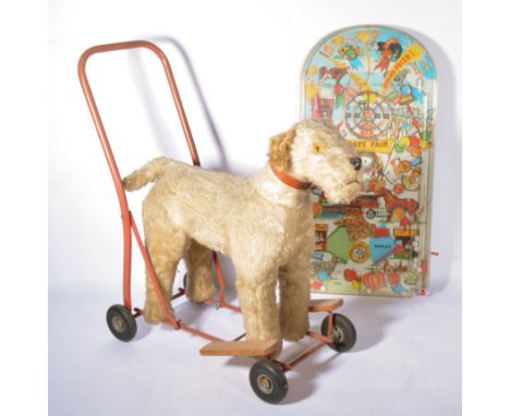 Plush push-along dog toy by Lines Bros, along with a Marx Toys bagatelle board, (2).