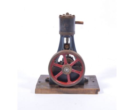 Stuart Turner model of a stationary beam engine, mounted on wood.