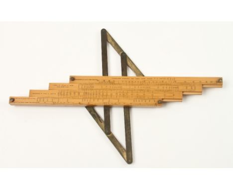 A rare, unusually designed 12" x 4 slide boxwood slide rule with brass pantograph hinge stamped BAINES Slide Rule No1 Patent 