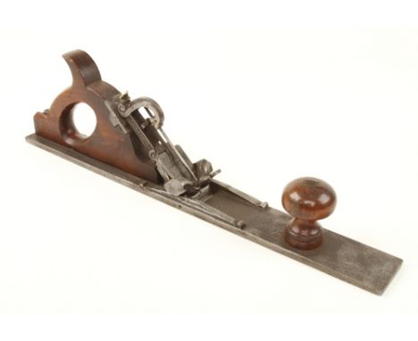 A very rare 20 1/2" adjustable French iron jointer by CHARDOILLET with fruitwood handle and front knob and unique ornate adju