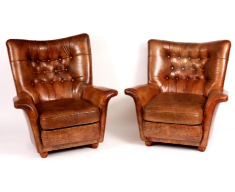 A STYLISH PAIR OF BROWN LEATHER BUTTON BACKED ARMCHAIRS with shaped backs, cushion seats and turned feet supports.   