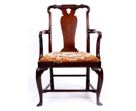 A GEORGE I CUBAN MAHOGANY GENTLEMAN'S OPEN ARMCHAIR with shaped top rail carved with C scrolls above a vase-shaped back splat