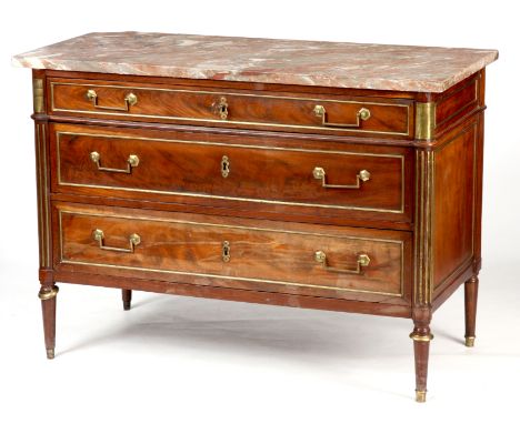 A LATE 18TH CENTURY FRENCH MAHOGANY BRASS MOUNTED COMMODE with veined marble top above three graduated drawers; standing on t