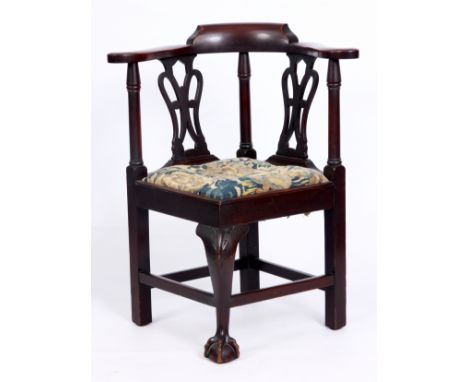 A 19TH CENTURY CHIPPENDALE STYLE MAHOGANY CHILDS CORNER CHAIR with shaped pierced splat back and a leaf carved cabriole front
