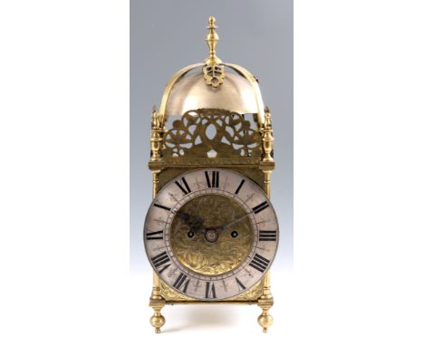 A 19TH CENTURY BRASS DOUBLE FUSEE LANTERN CLOCK with engraved dial and silvered chapter ring, having a posted frame case with