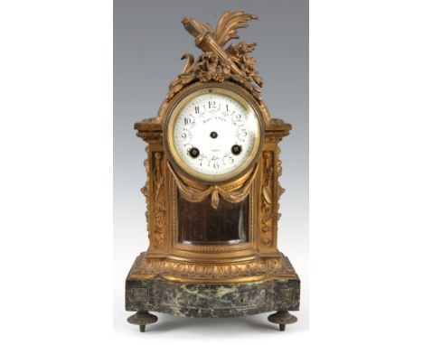 A LATE 19th CENTURY FRENCH MARBLE AND ORMOLU MANTEL CLOCK SIGNED MAPLE AND CO the bow fronted case with bevelled glass panel 