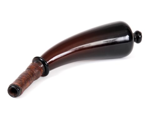 AN 18TH CENTURY AMBER COLOURED HORN SHAPED POWDER FLASK with wrapped around reeded handle grip 35cm across.