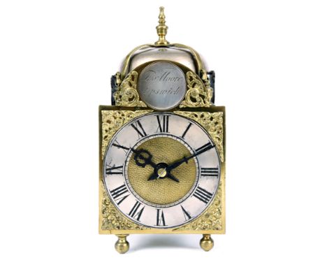 THOMAS MOORE, IPSWICHA 19TH CENTURY MINIATURE BRASS LANTERN CLOCK having a 4" arched dial with silvered chapter ring, brass c