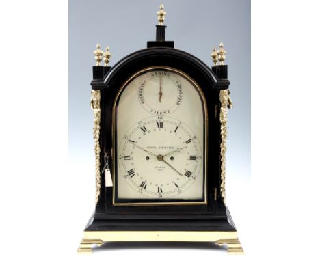 GRAVELL &amp; TOLKIEN, LONDON A GEORGE III EBONISED BRACKET CLOCK the arch top case with brass finials, side carrying handles