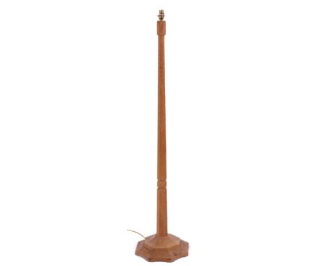 A ROBERT (MOUSEMAN) THOMPSON AZED OAK STANDARD LAMP with hexagonal tapered stem and stepped base with carved&nbsp;mouse signa