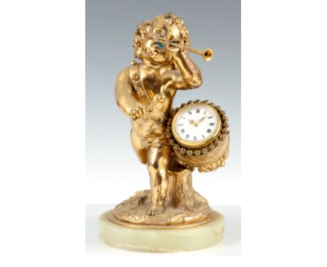 A LATE 19th CENTURY ORMOLU MANTEL CLOCK formed as a drummer boy standing on onyx base with 35mm porcelain dial enclosed in th