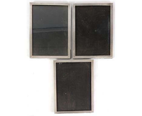 A PAIR OF GEORGE V LARGE RECTANGULAR SILVER PICTURE FRAMES with engine turned borders and easel backs 40.5cm high 29cm wide B