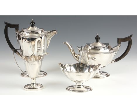 A FOUR PIECE SILVER TEA SERVICE of slender fluted form with ebonised handles by Mappin and Webb, Sheffield dated 1896 37oz.