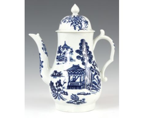 AN 18TH CENTURY FIRST PERIOD WORCESTER COFFEE POT AND COVER decorated with pagodas set in landscapes 23cm high.