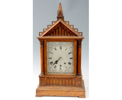 A LATE 19th CENTURY OAK CASED EIGHT BELL QUARTER CHIMING BRACKET CLOCK the gothic  style case with architectural pediment and