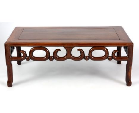 A 19TH  CENTURY CHINESE HARDWOOD LOW OCCASIONAL TABLE with scroll cut-out frieze on branch legs 76.5cm wide 41cm deep 28cm hi