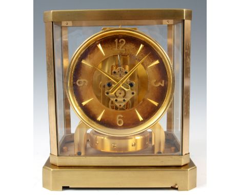 A 1950&rsquo;s JAEGER-LECOULTRE ATMOS CLOCK the glazed gilt case enclosing a skeletonised dial with Arabic quarters and baton