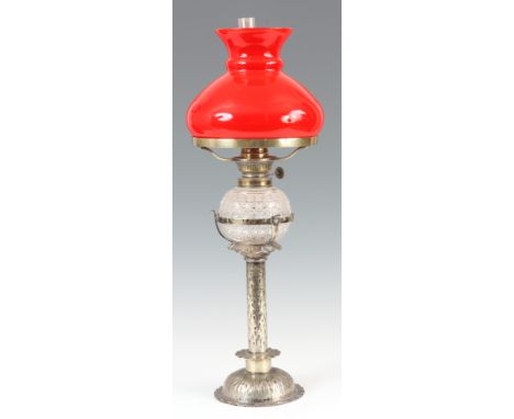 AN EARLY 20th CENTURY ARTS AND CRAFTS SILVER PLATED OIL LAMP having decorative column with bark style decoration, cut glass o