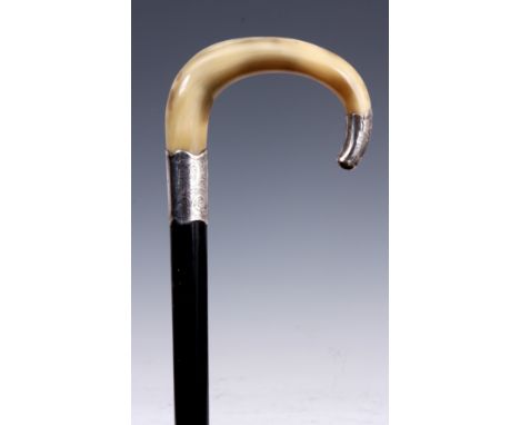 A LATE 19th CENTURY HORN HANDLED WALKING CANE the curved handle having engraved silver tip and collar on ebonised stick 93cm 